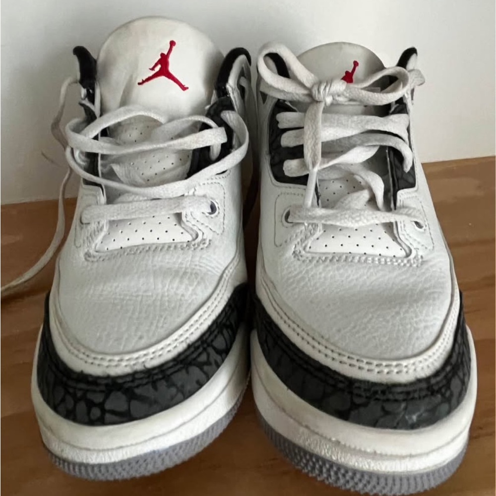 Nike Jordan Kids' White and Black Basketball Sneakers with Red Logo